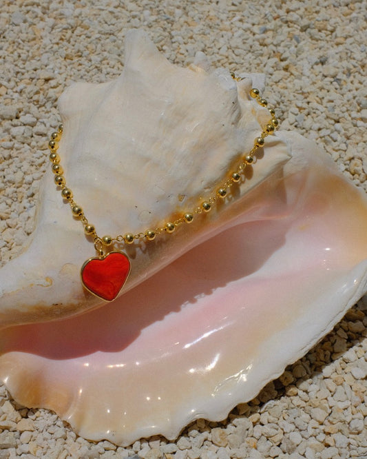 heart pendant necklace, bold gold necklace, colorful charm necklace, trendy heart jewelry 2025, statement necklace for summer, handmade Miami jewelry, red heart necklace, resin pendant necklace