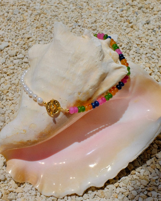 Colorful beaded necklace with a gold sun clasp and freshwater pearls beach summer trendy stack