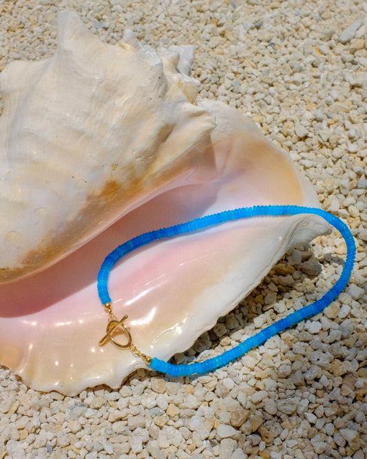 Blue necklace with a gold clasp beachy beachy summer necklace stack trendy style stylish