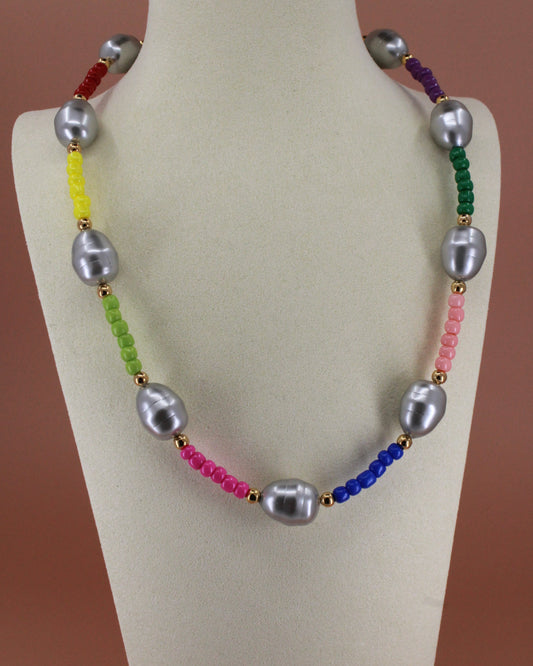 Handmade colorful glass bead necklace with imitation mother of pearls and gold accents, bold statement jewelry by Cuya.