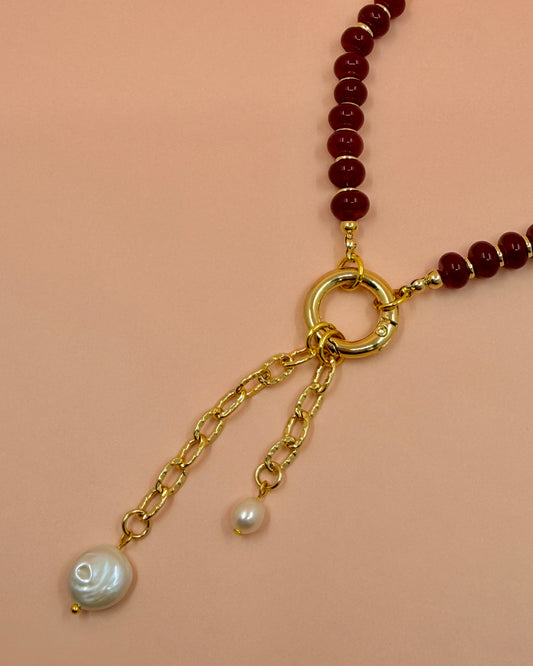 Handcrafted red gemstone necklace featuring freshwater pearls and an 18K gold plated chain. The Amara Necklace is available in 16”, 18”, and 20”.