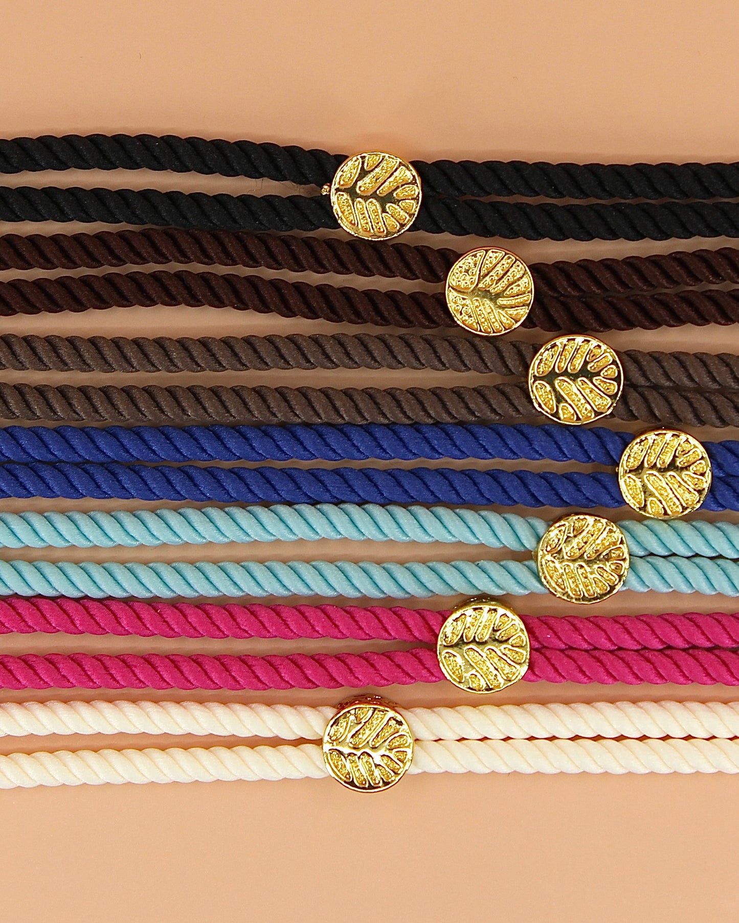 Adjustable cord bracelet, handmade coastal jewelry by Cuya, available in multiple colors.