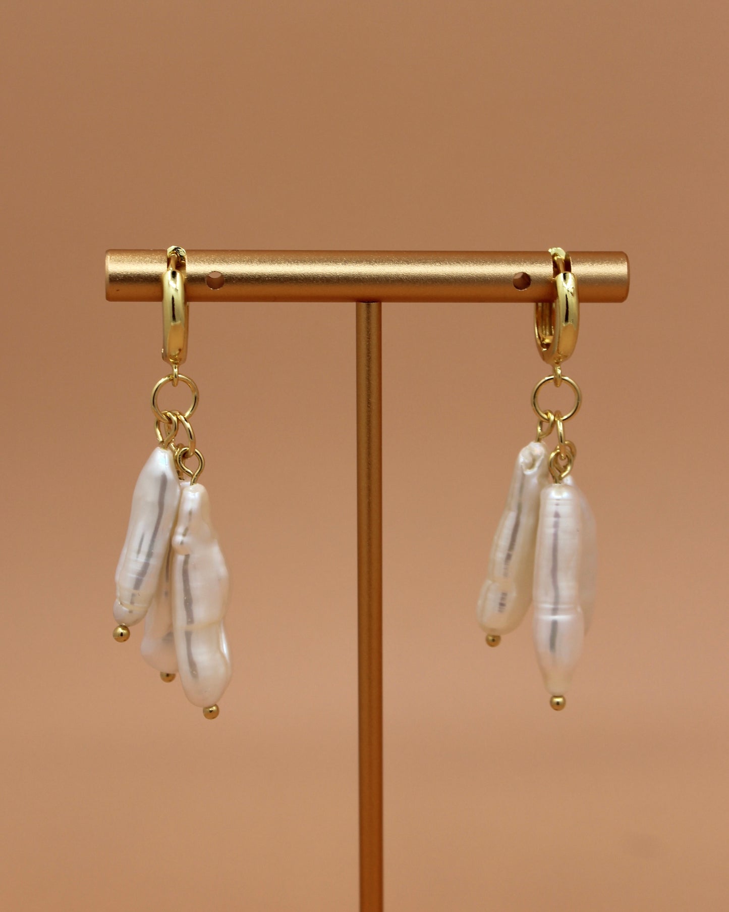 Handmade biwa freshwater pearl dangle earrings on 18k gold plated hoops, modern statement pearl jewelry by Cuya.
