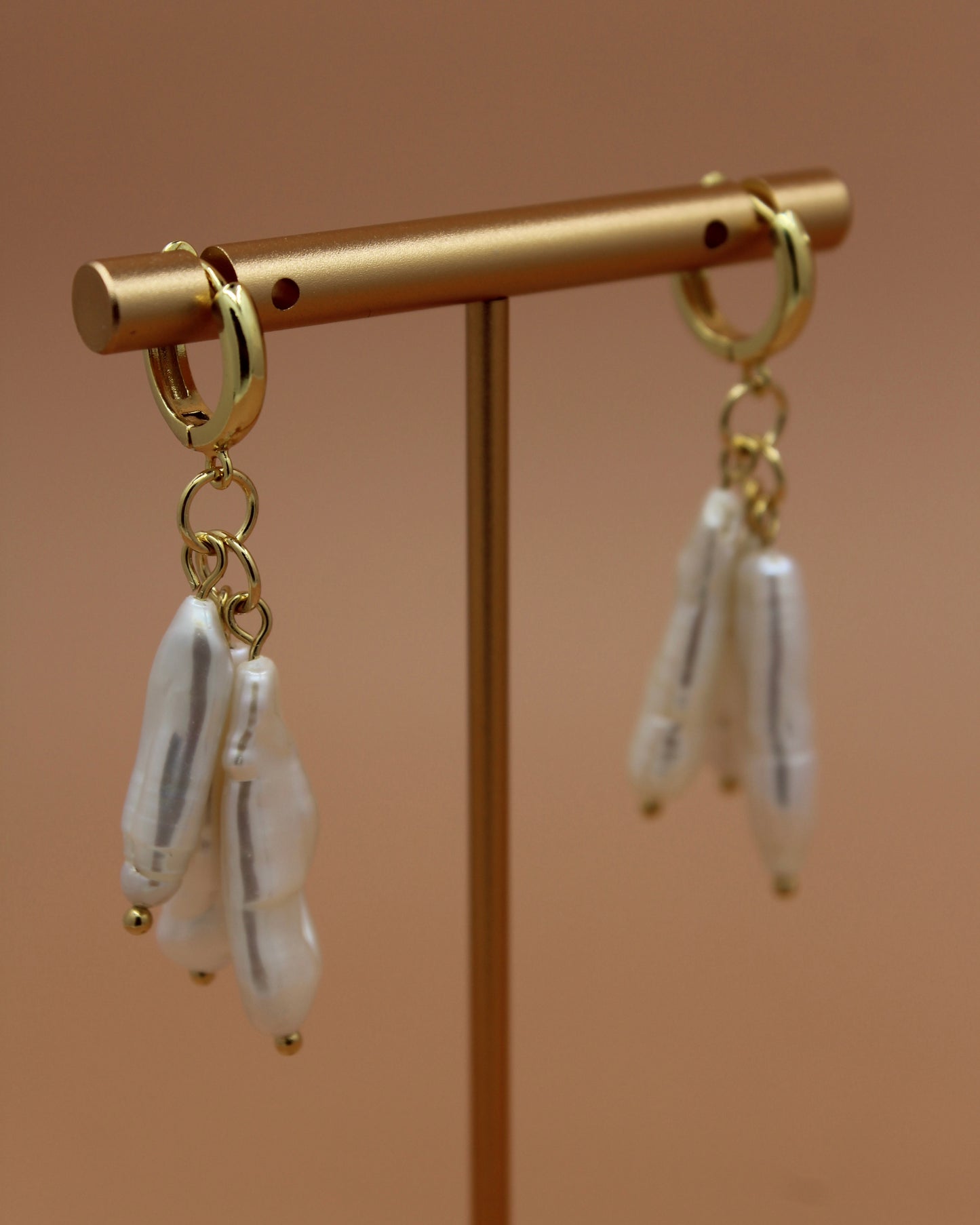 Handmade biwa freshwater pearl dangle earrings on 18k gold plated hoops, modern statement pearl jewelry by Cuya.