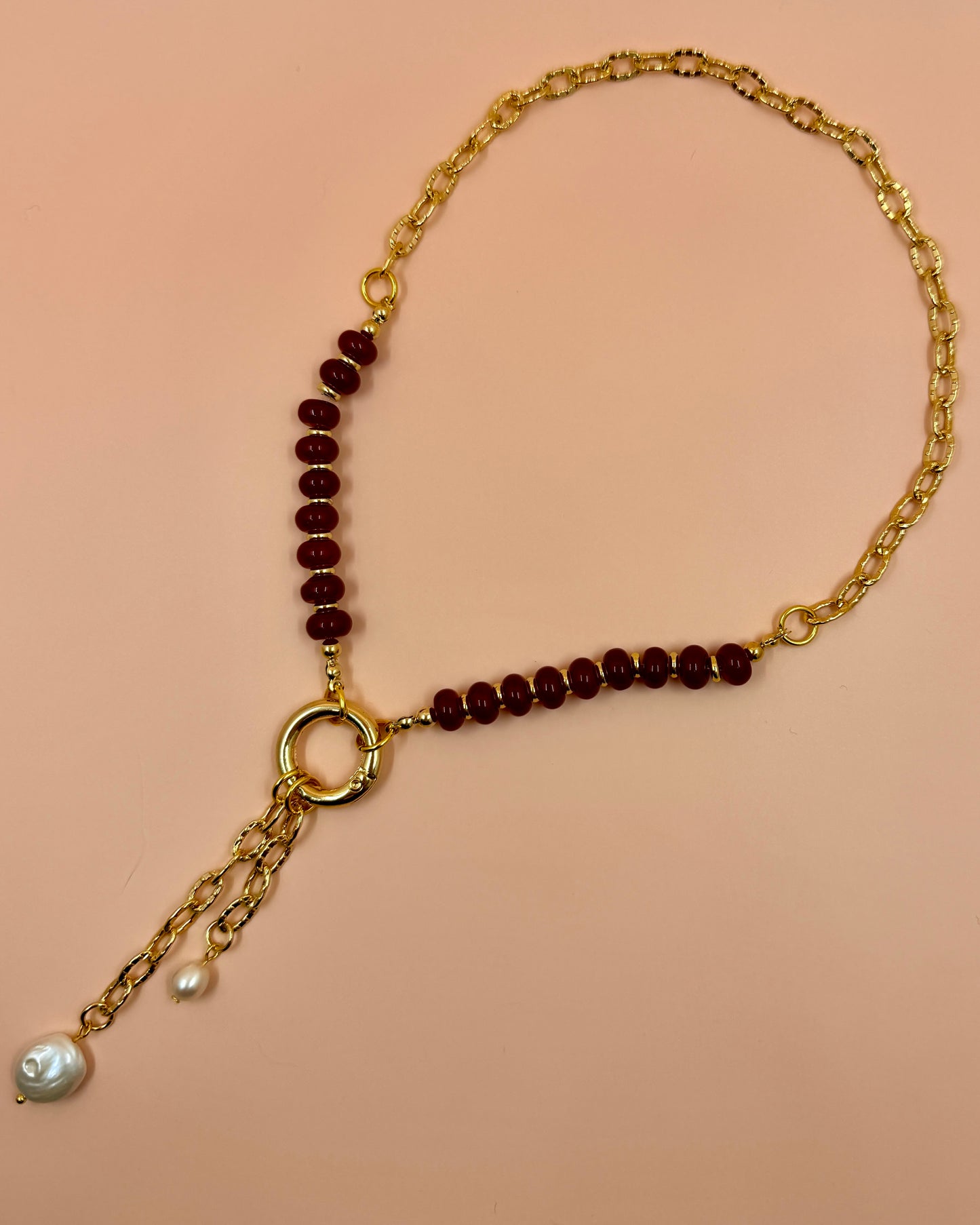 Handcrafted red gemstone necklace featuring freshwater pearls and an 18K gold plated chain. The Amara Necklace is available in 16”, 18”, and 20”.
