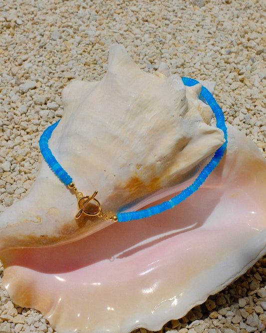 Blue necklace with a gold clasp beachy beachy summer necklace stack trendy style stylish