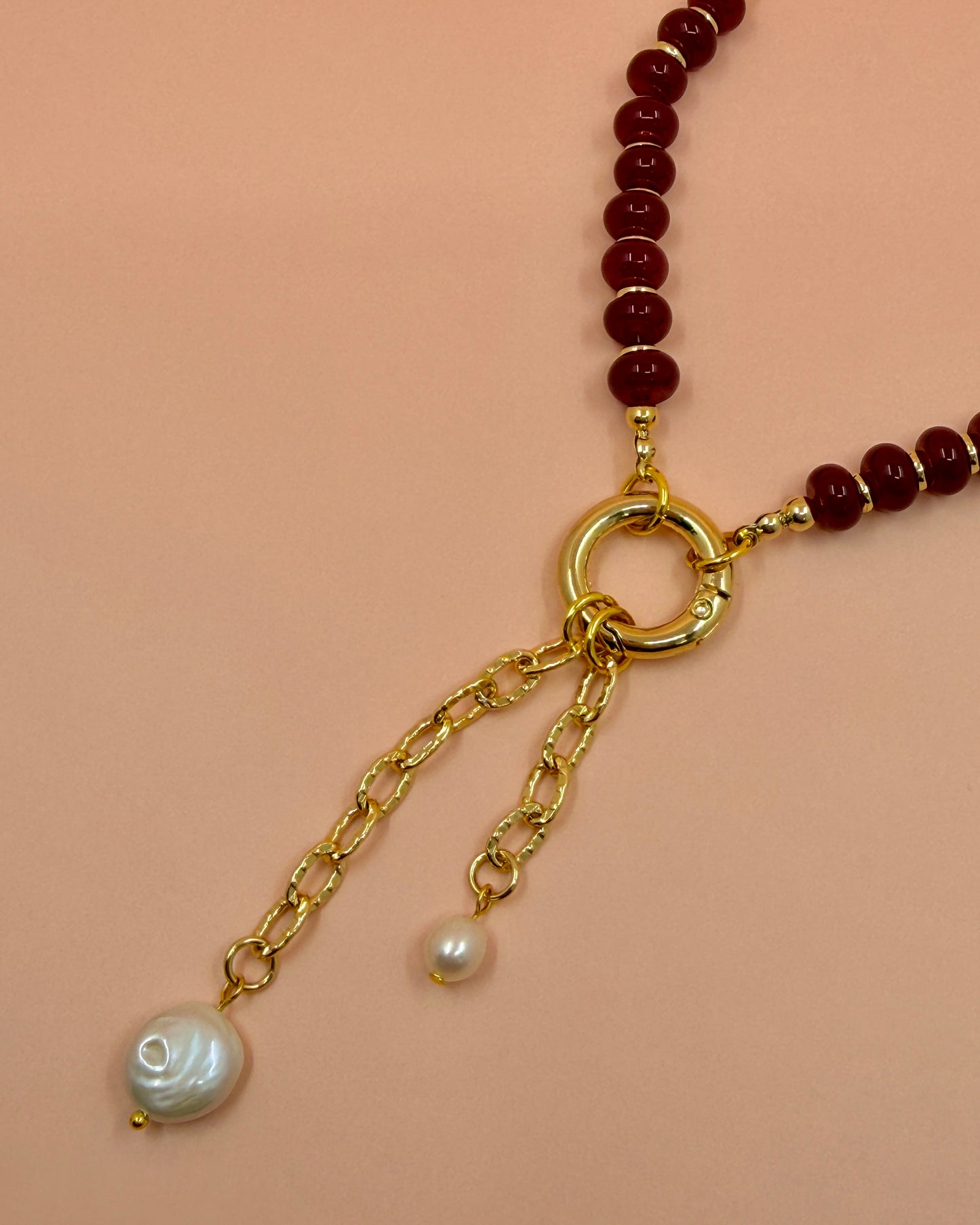 Handcrafted red gemstone necklace featuring freshwater pearls and an 18K gold plated chain. The Amara Necklace is available in 16”, 18”, and 20”.