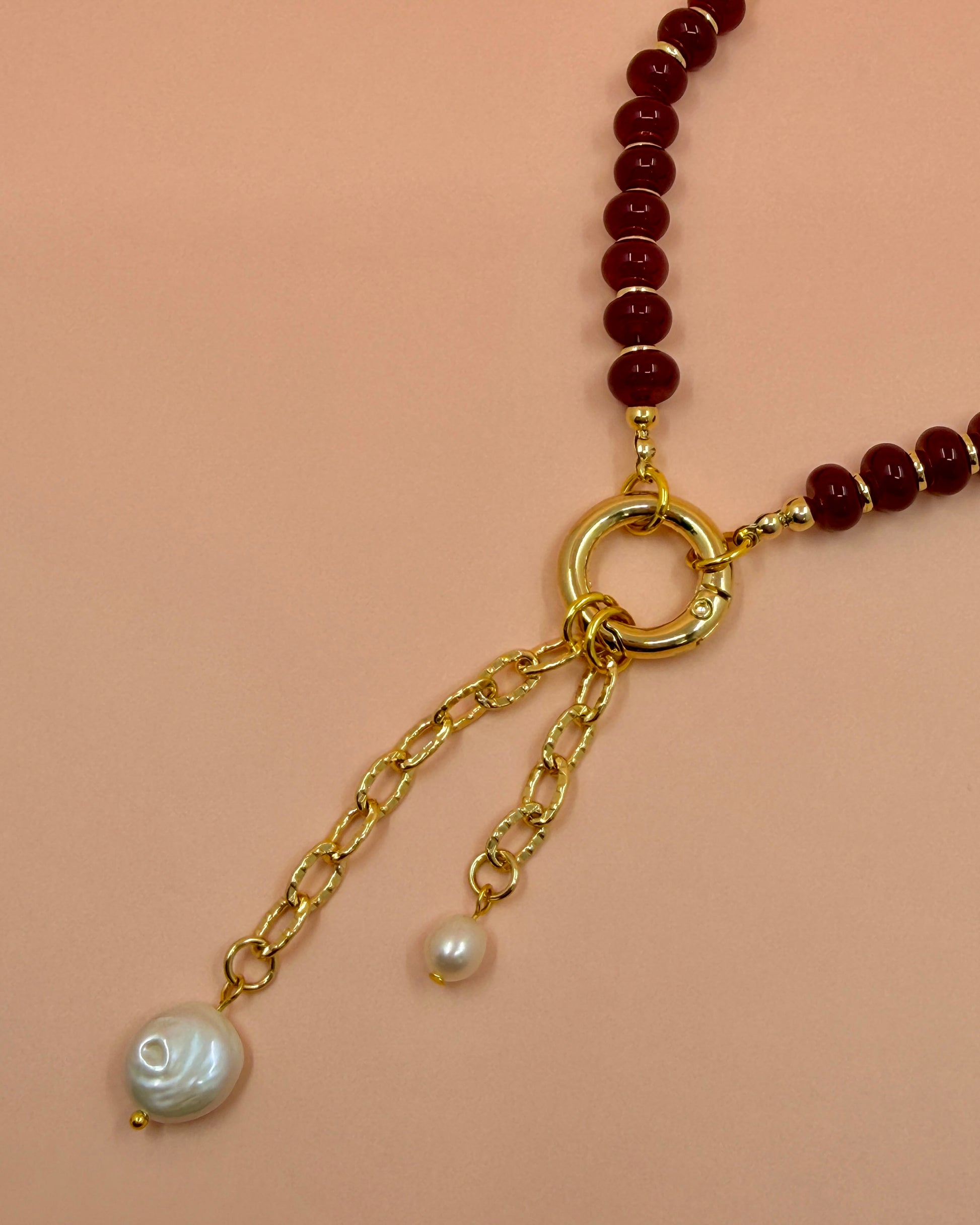 Handcrafted red gemstone necklace featuring freshwater pearls and an 18K gold plated chain. The Amara Necklace is available in 16”, 18”, and 20”.