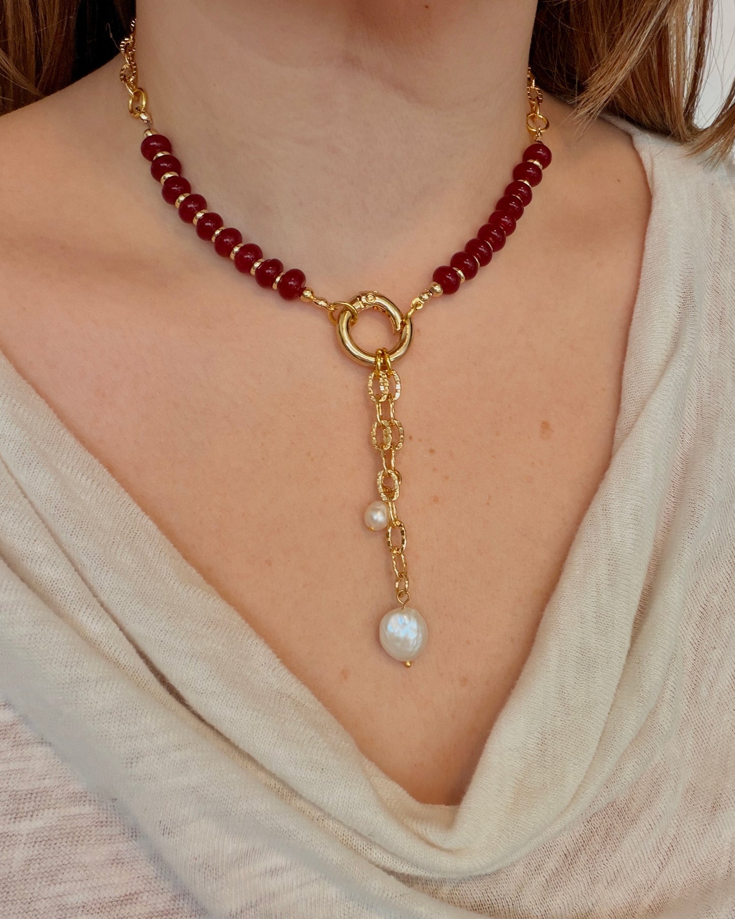 Handcrafted red gemstone necklace featuring freshwater pearls and an 18K gold plated chain. The Amara Necklace is available in 16”, 18”, and 20”.
