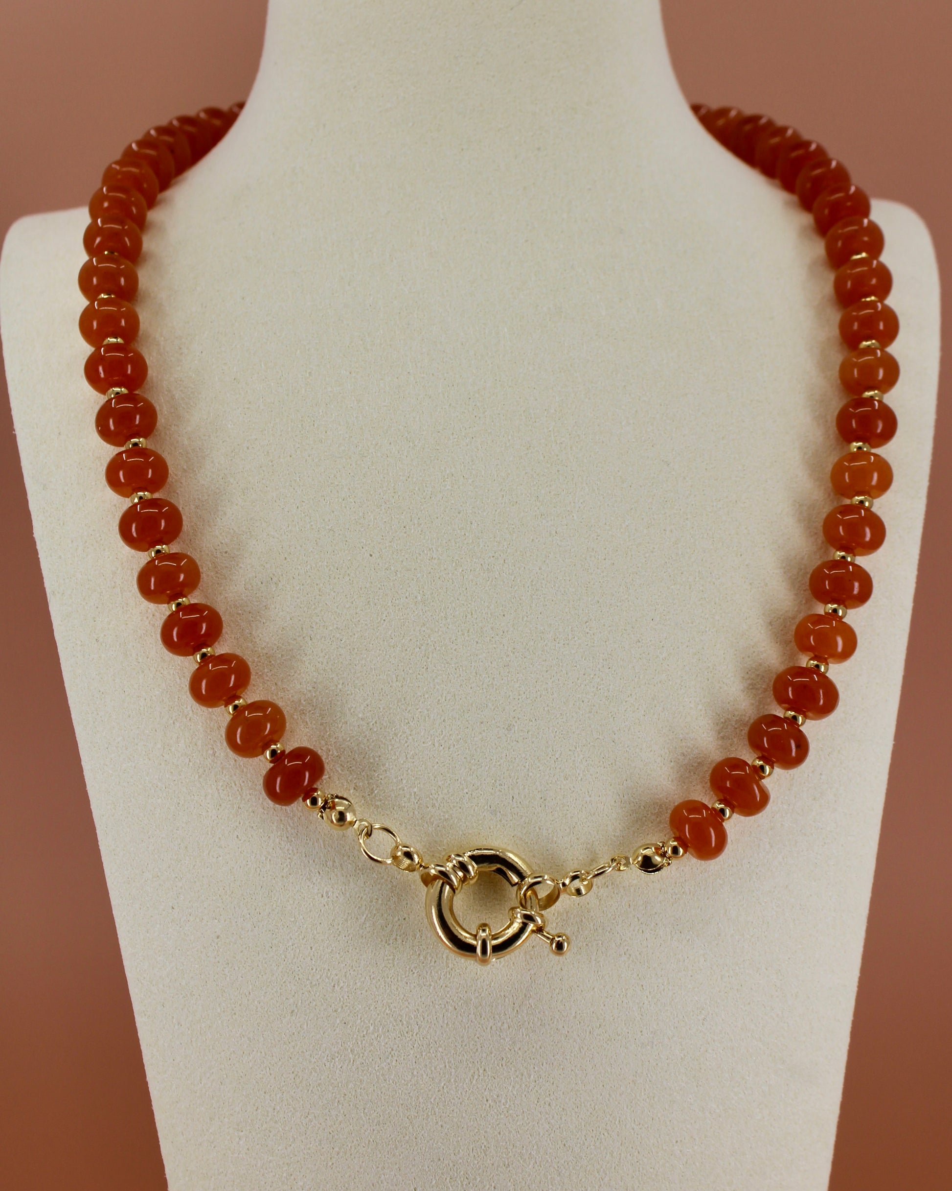 Handmade beaded necklaces in navy blue, green, yellow and orange with gold sailor clasps for interchangeable charms, customizable coastal jewelry by Cuya.