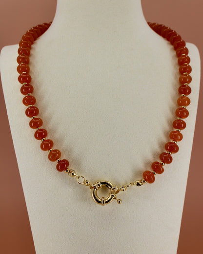 Handmade beaded necklaces in navy blue, green, yellow and orange with gold sailor clasps for interchangeable charms, customizable coastal jewelry by Cuya.