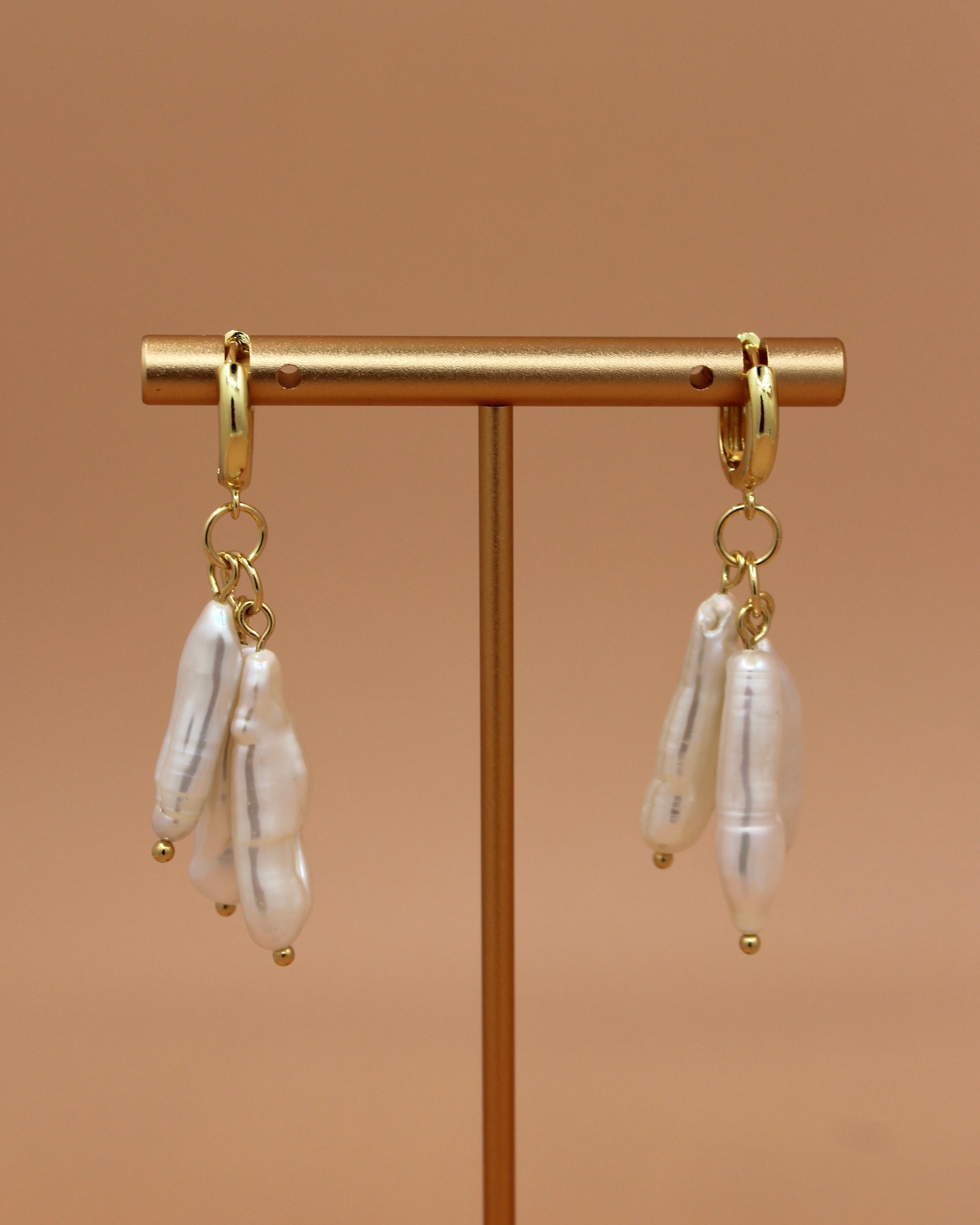 Handmade biwa freshwater pearl dangle earrings on 18k gold plated hoops, modern statement pearl jewelry by Cuya.