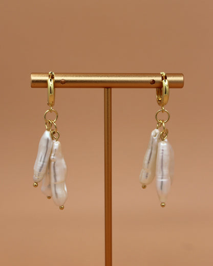 Handmade biwa freshwater pearl dangle earrings on 18k gold plated hoops, modern statement pearl jewelry by Cuya.