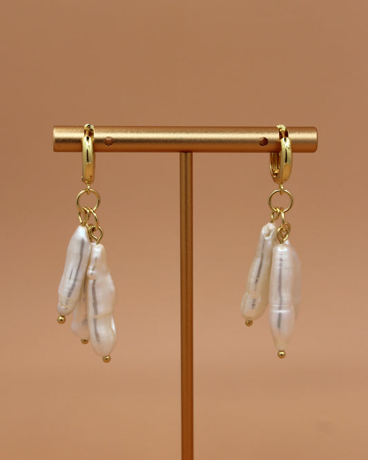 Handmade biwa freshwater pearl dangle earrings on 18k gold plated hoops, modern statement pearl jewelry by Cuya.