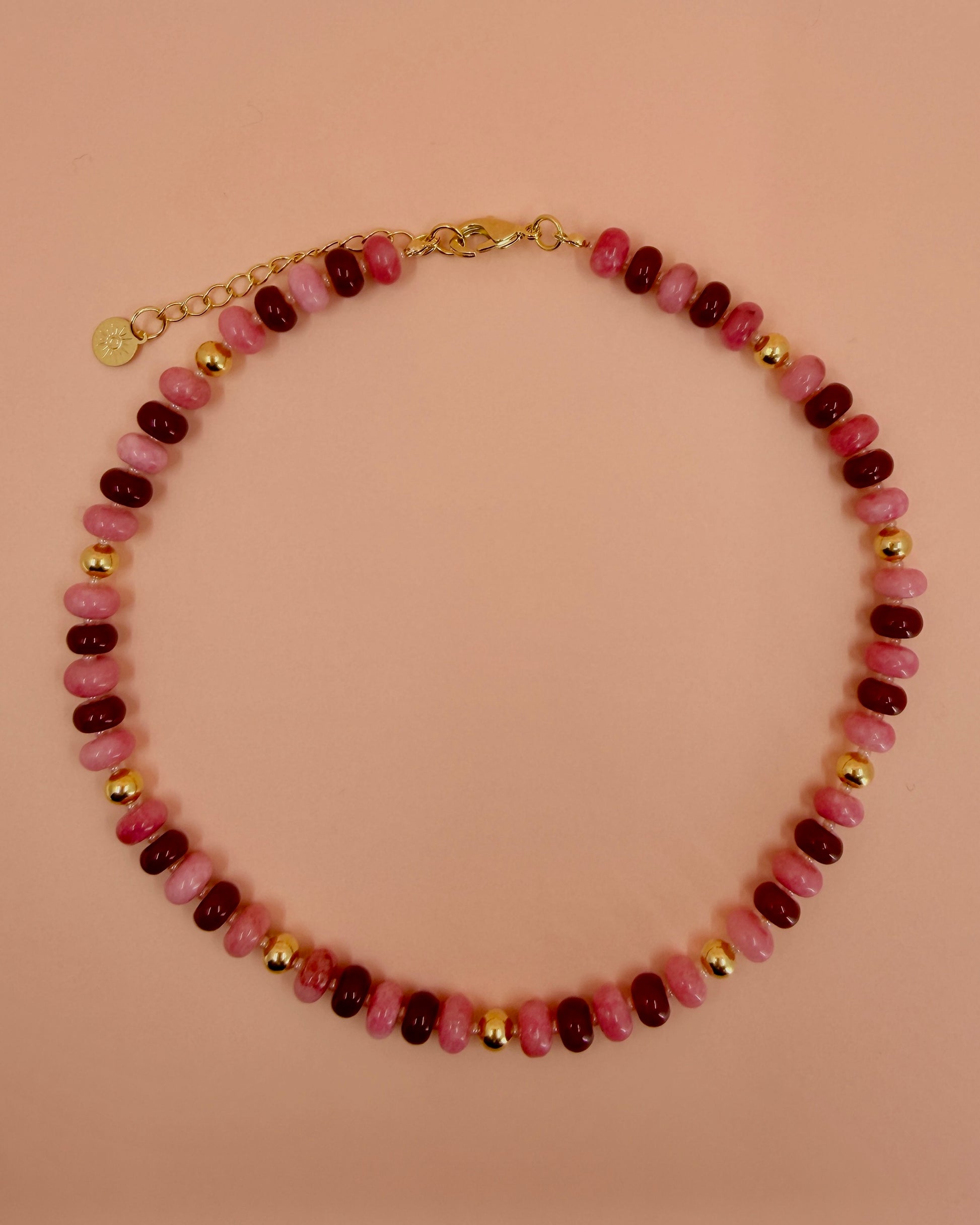 Handcrafted pink and red gemstone necklace with high-quality 18K gold plated beads and findings. The Capri Necklace adds a bold pop of color.