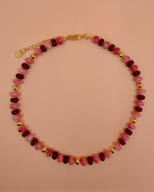 Handcrafted pink and red gemstone necklace with high-quality 18K gold plated beads and findings. The Capri Necklace adds a bold pop of color.