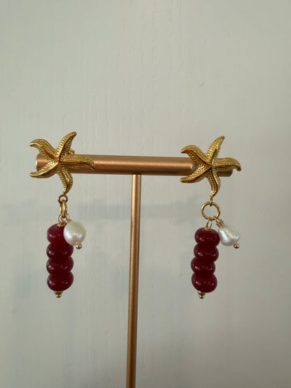 Limited-edition starfish earrings featuring gold-plated stainless steel, jade beads, and freshwater pearls. Handmade in small batches by Cuya Jewelry.