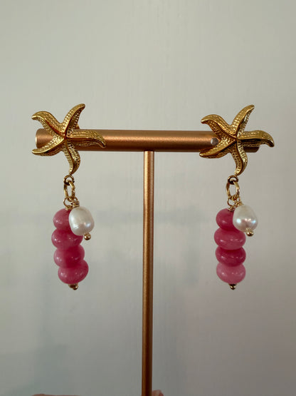 Limited-edition starfish earrings featuring gold-plated stainless steel, jade beads, and freshwater pearls. Handmade in small batches by Cuya Jewelry.