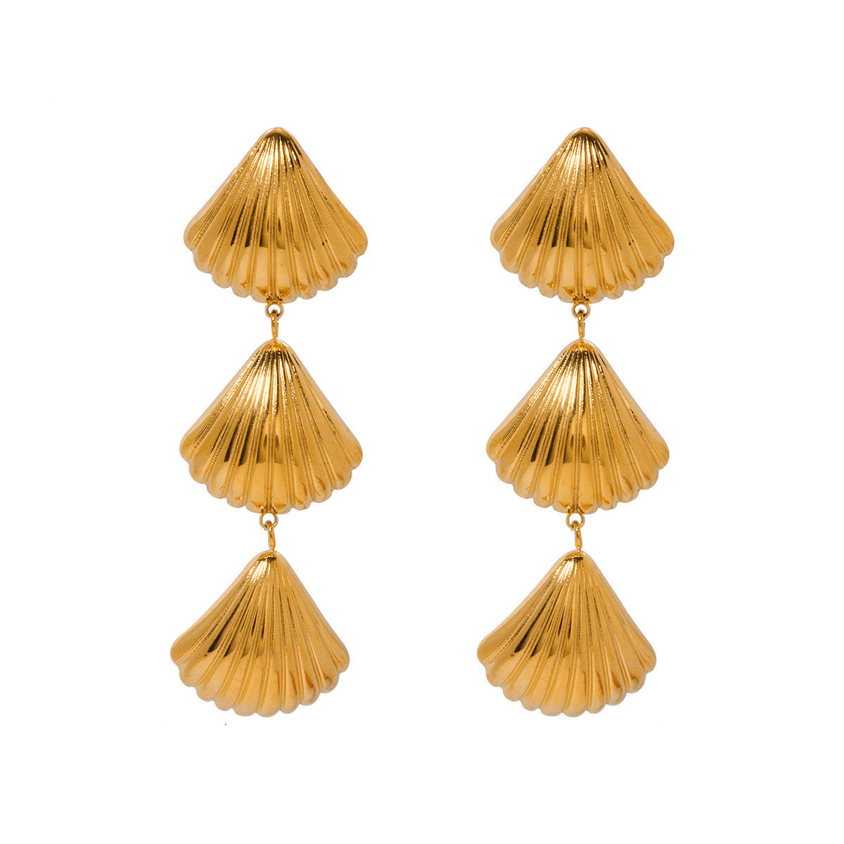 Gold shell-shaped earrings on a seashell beachy summer beach ocean sea hippie boho chic travel trendy stylish style