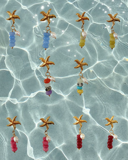 Limited-edition starfish earrings featuring gold-plated stainless steel, jade beads, and freshwater pearls. Handmade in small batches by Cuya Jewelry.